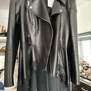 This is a brand new Alexander McQueen leather jacket size 12  brand nee piece